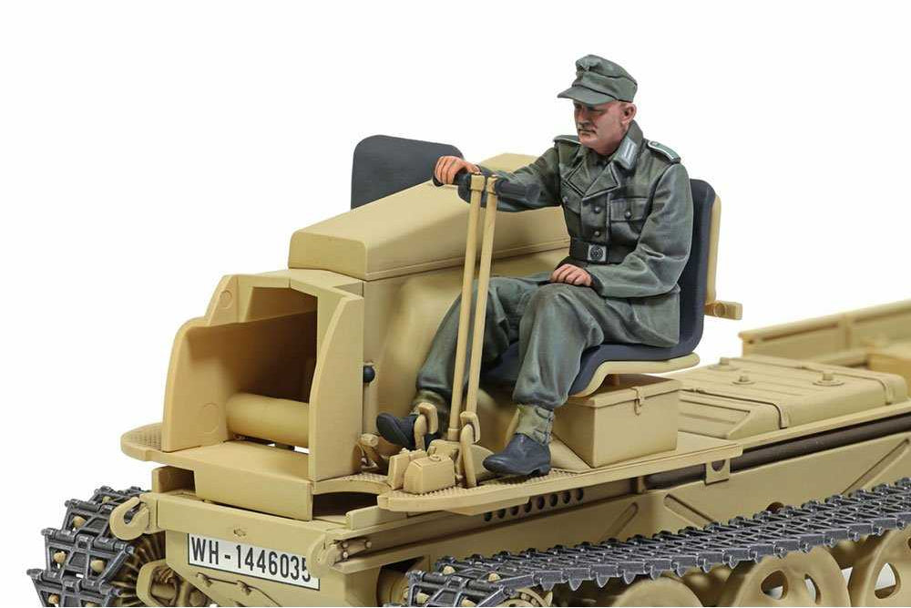 A detailed scale model of a German military bulldozer with a seated soldier figure, shown against a plain white background.